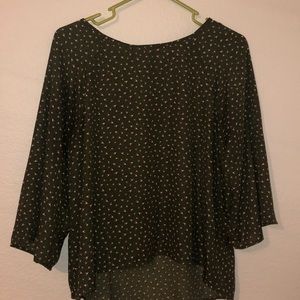 Green blouse with tiny flowers.